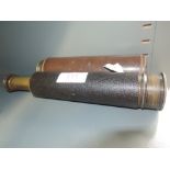 A traditional brass telescope by Brittanic & Co, England, having leather sheath and a similar