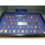 A collectors set of Coats of Arms of The Great Monarchs of History in Display Case