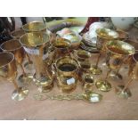 A selection of brass goblets and similar