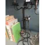 A selection of wrought iron candle sticks