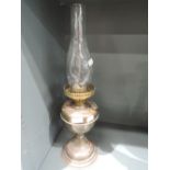 A brass bodied oil burning lamp
