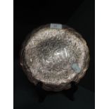 A vintage copper tray of Middle Eastern scallop edge design having white metal inlay