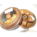 A souvenir olive wood travel candle stand with marquetry cartouche