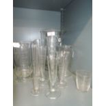 A selection of medical pharmaceutical or apothecary measures including large footed beaker