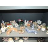 A selection of ceramic studies including Wade, Lilliput Lane etc