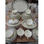 A Minton dinner service having gilt heightened Grasmere pattern