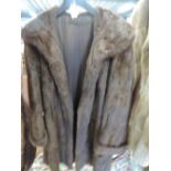 A vintage 3/4 length brown fur coat, good condition, approx medium in size.