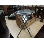 A folding drum/keyboard stool