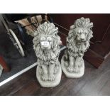 A pair of modern concrete ornamental lions
