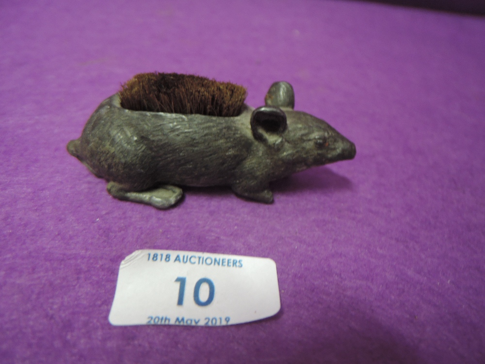 A pewter pin cushion in the form of a life size mouse