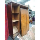 An early 20th Century walnut wardrobe and dressing table by Waring and Gillows