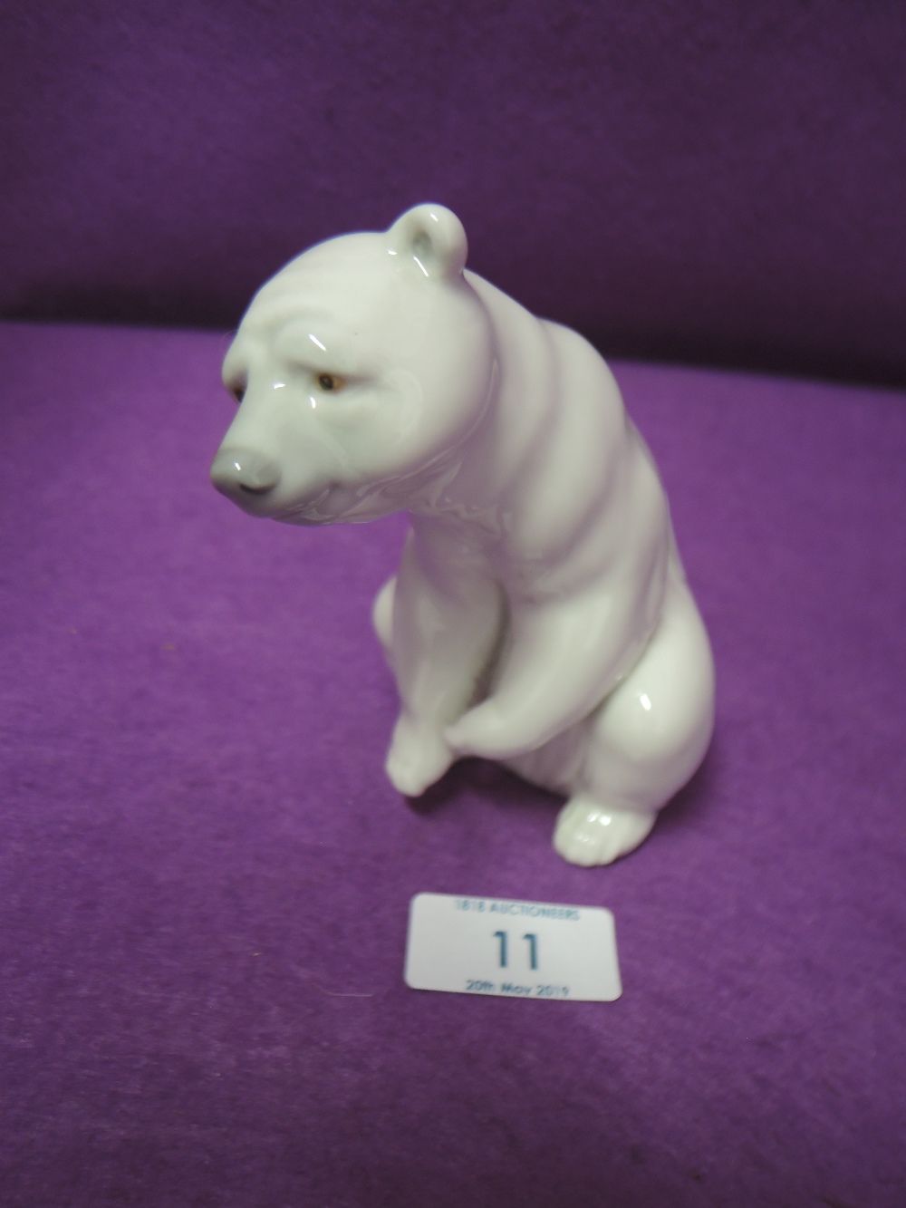 A Lladro figure of a seated polar bear