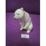 A Lladro figure of a seated polar bear