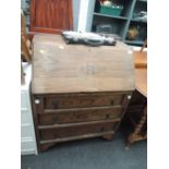 An early to mid 20th Century oak bureau