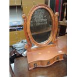 A modern dressing table mirror with drawer base