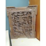 An Oriental carved panel, mythical creatures, including Hanuman