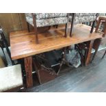 A rustic wooden kitchen/dining table