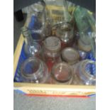 A selection of kitchen ware jars and similar bottles