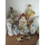 A selection of figures and figurines including mirrored hand decorated pug dog pair and flatbacks