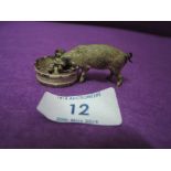 A cold painted bronze figure of a farm yard pig feeding bearing stamp to base