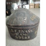 An early 20th century hat box with tin and pressed body bearing luggage badge and stencilled