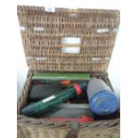 A selection of fishing tackle including wicker basket