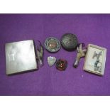 A small selection of vintage white metal costume jewellery including shield brooch, claw brooches,