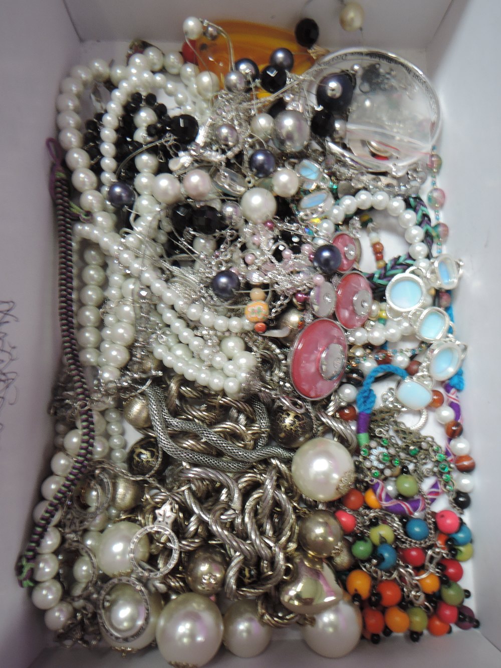 A selection of costume jewellery including Pilgrim necklaces, beads, bangle etc