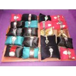 A wooden case containing 20 lady's fashion wrist watches of various makes and designs