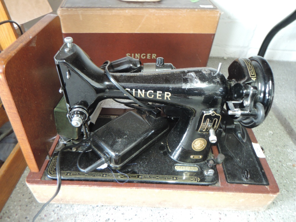 An electric Singer sewing machine 99K no. EM487995 with case and extras