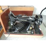 An electric Singer sewing machine 99K no. EM487995 with case and extras