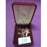 A yellow metal cross of plain form stamped 9ct on a fine yellow metal chain stamped 14k, (AF) and