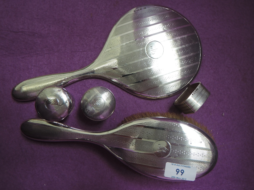 A selection of silver dressing table items including brush, mirror, two glass pots and a band (af)