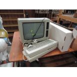 A vintage Amstrad 256K Personal Computer Word Processor 8512 with two extra keyboards
