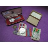 A WW2 War medal and Defence medal with original paperwork and box, and a cased white metal Junior