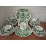A part tea service by Coalport with green glaze Chinese dragon design