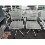 A pair of modular and office chair, maybe suitable for occasional outdoor use or as conservatory
