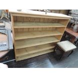 A stripped pine bookshelf