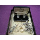 A small selection of white metal jewellery including HM silver wedding band, marcasite brooches,
