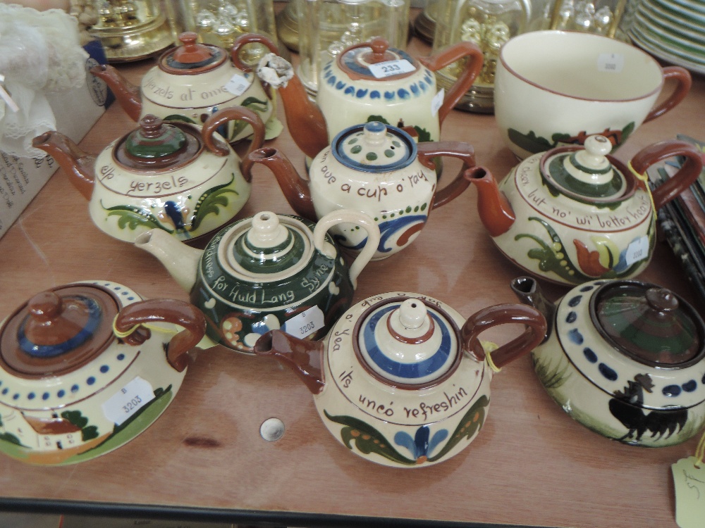 A selection of Cornish motto wares including teapot and cup