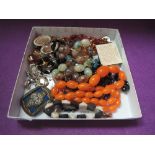 A small selection of costume jewellery including rolled gold locket, baltic amber necklace,