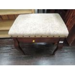 An early 20th Century stained frame piano stool