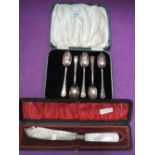 A cased part set (5) of HM silver teaspoons having moulded decoration and a cased Edwardian silver