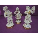 Three ceramic figures in a Dresden style bearing marks and stamp to base