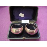 A cased pair of HM silver napkin rings of plain form
