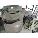 A selection of fishing or similar out door rucksacks and bags