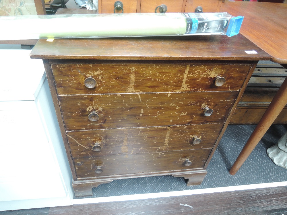 A vintage stained frame low chest of 4 long drawers