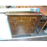 A vintage stained frame low chest of 4 long drawers