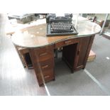A mid 20th Century oak kidney shaped dressing table