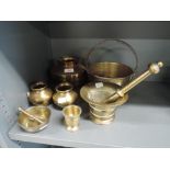 A selection of brass wares including small jam pan and mortar and pestle